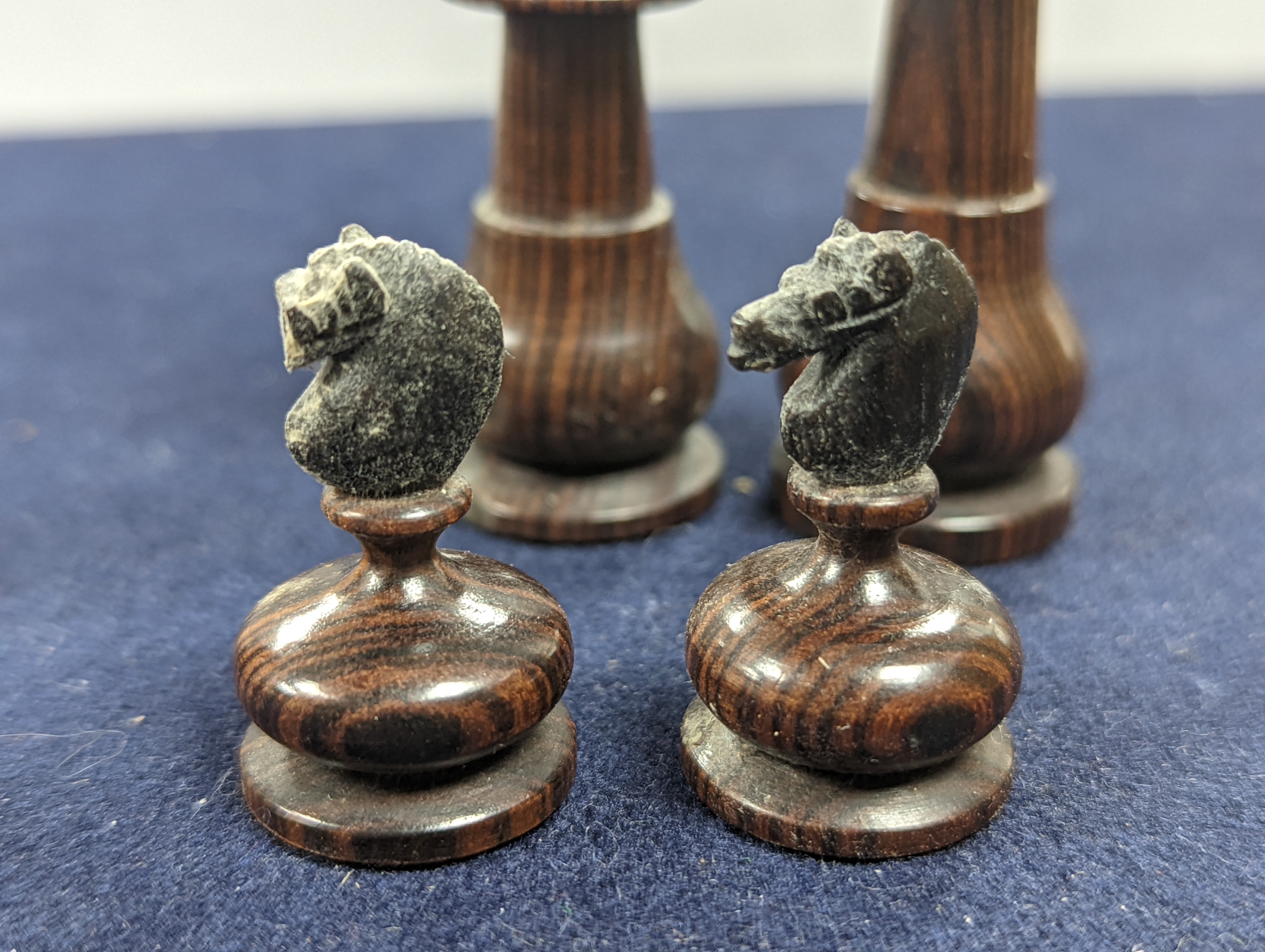 A Victorian brass inset mahogany games box, fitted with solitaire, cribbage, chessmen, draughts etc., 33cm, a turned and stained bone chess set, another games box containing chessmen and draughts